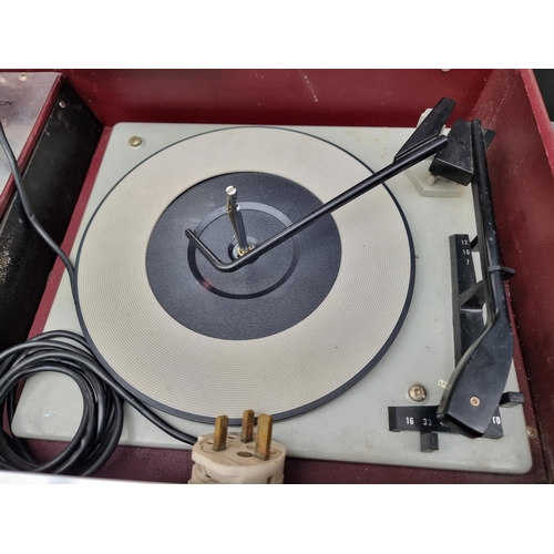 1282 - A vintage Clarendon TCRS9 portable record player, with detachable radio.