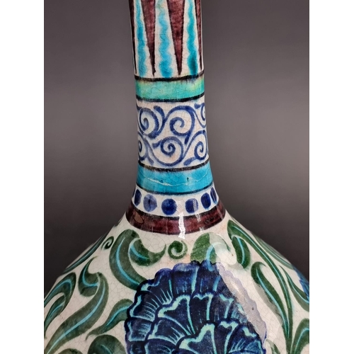 1287 - A William de Morgan pottery bottle vase, painted with Persian style flowers, 32cm high.... 