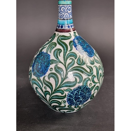1287 - A William de Morgan pottery bottle vase, painted with Persian style flowers, 32cm high.... 