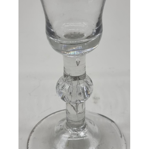 1296 - An 18th century beaded knop wine glass, 16.5cm high, (irregular foot rim).