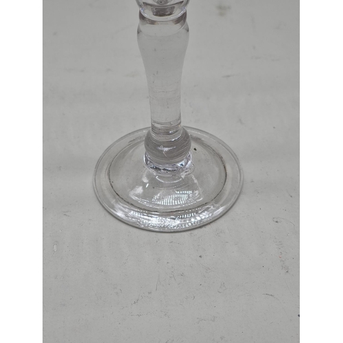 1300 - An 18th century gin glass, 12.5cm high. 