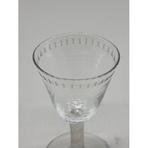 1301 - An 18th century incised twist stemmed glass, 12.5cm high.