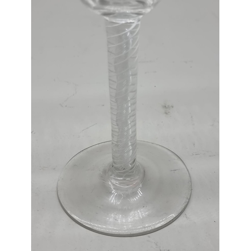 1302 - An 18th century combined twist stem wine glass, 15.5cm high.