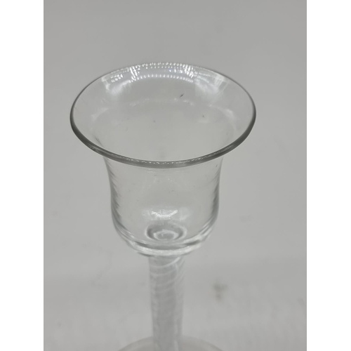 1302 - An 18th century combined twist stem wine glass, 15.5cm high.