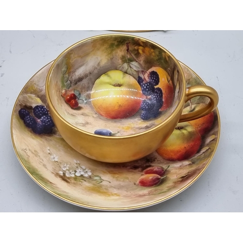 1306 - A Royal Worcester fruit painted cabinet cup and saucer, painted by Ricketts, the saucer 17cm diamete... 