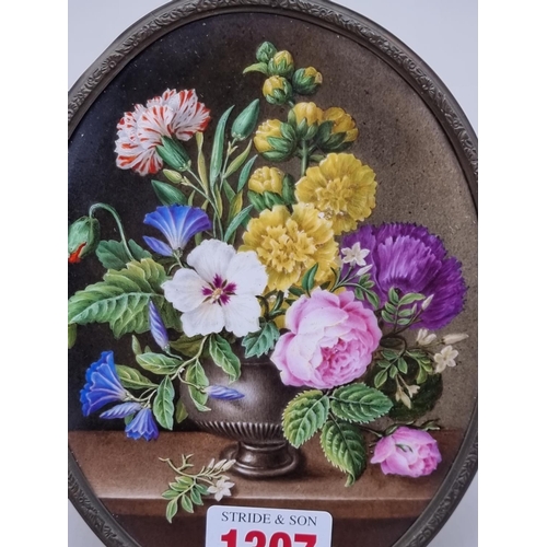 1307 - A Continental porcelain floral painted plaque, 14.5 x 11cm oval. 