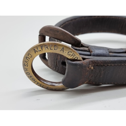 1311 - A Victorian brass and leather dog collar, inscribed 'Alfred A Grosvenor, Guys Hospital', further ins... 