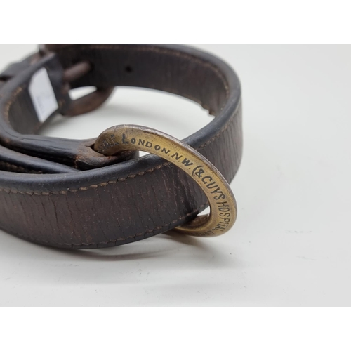 1311 - A Victorian brass and leather dog collar, inscribed 'Alfred A Grosvenor, Guys Hospital', further ins... 