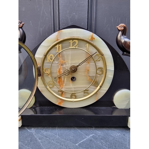 1322 - An Art Deco slate and green onyx clock garniture, the clock 52.5cm wide.  ... 