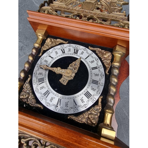 1380 - A Dutch mahogany and brass wall clock, with weights and pendulum.