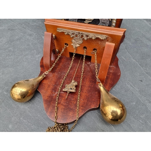 1380 - A Dutch mahogany and brass wall clock, with weights and pendulum.