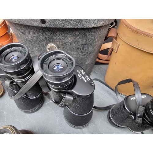 1389 - Four pairs of binoculars; together with a cased pair of opera glasses. (5)