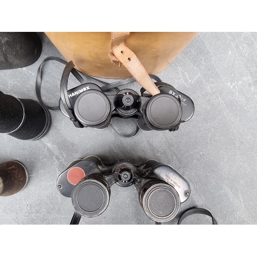 1389 - Four pairs of binoculars; together with a cased pair of opera glasses. (5)