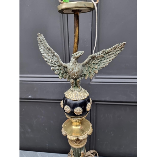 1404 - A French Empire style ebonized and brass table lamp, height excluding fitting 75cm.