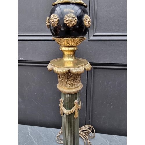 1404 - A French Empire style ebonized and brass table lamp, height excluding fitting 75cm.