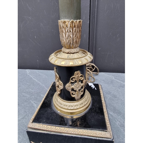 1404 - A French Empire style ebonized and brass table lamp, height excluding fitting 75cm.