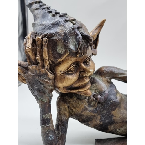 1420 - A bronze Pixie, 55cm wide.