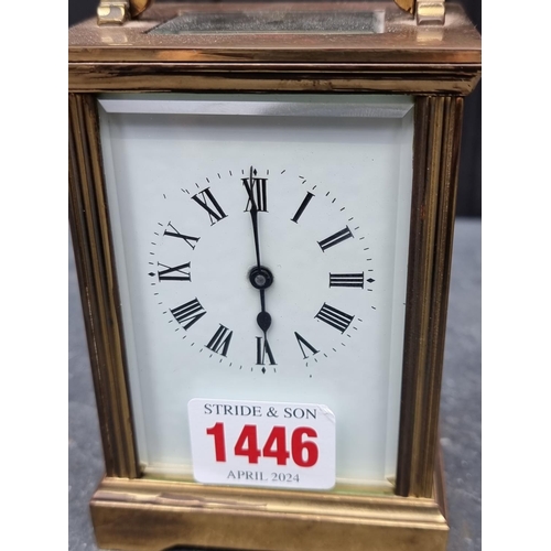 1446 - A brass carriage timepiece, height including handle 15cm.