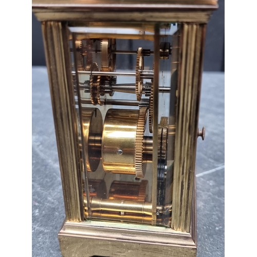 1446 - A brass carriage timepiece, height including handle 15cm.