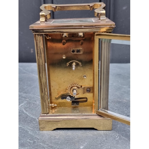 1446 - A brass carriage timepiece, height including handle 15cm.