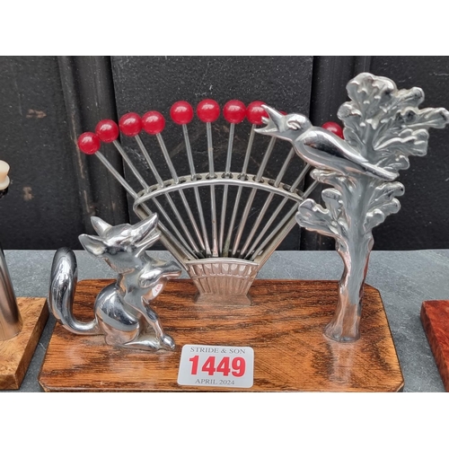 1449 - Four Art Deco cocktail stick stands, largest 15cm high. 