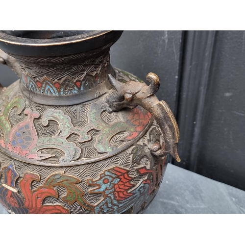 1457 - A Chinese bronze and champleve enamel twin handled vase, 24cm high.