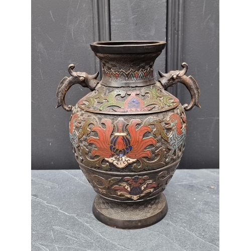 1457 - A Chinese bronze and champleve enamel twin handled vase, 24cm high.