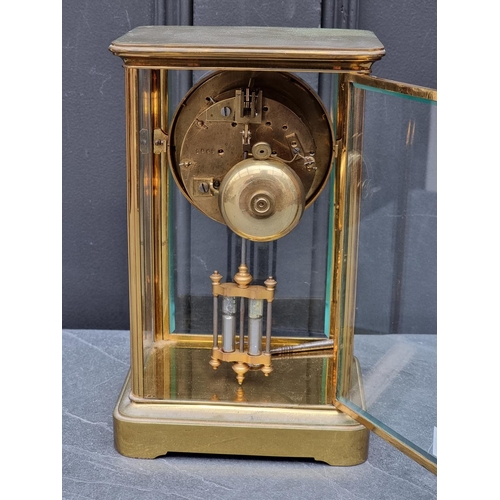 1458 - An antique brass four glass mantel clock, with mercury pendulum, 25cm high, (s.d. to dial). ... 