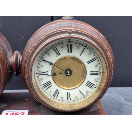 1462 - A late Victorian walnut combined clock and barometer set, with ivorine dials, 23.5cm wide.... 