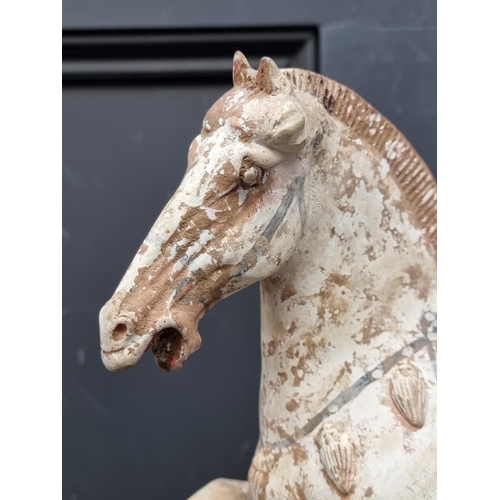 1468 - A Chinese Tang style pottery horse, 32cm high, (s.d.).