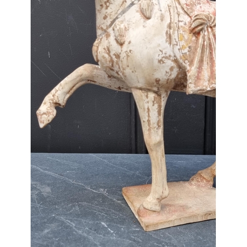 1468 - A Chinese Tang style pottery horse, 32cm high, (s.d.).