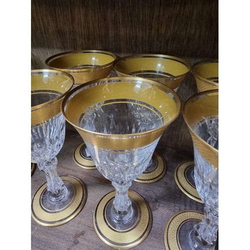 1485 - A suite of St Louis clear and gilt drinking glasses, largest 17cm high. (15)