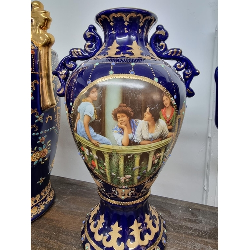 1499 - A large Continental porcelain twin handled vase, 59.5cm, (cracked to rim); together with three furth... 