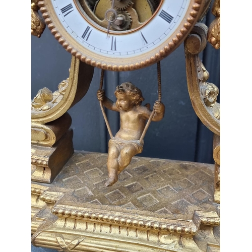 1510 - A gilt spelter mantel clock, 31cm high, with figural pendulum, (pediment detached).