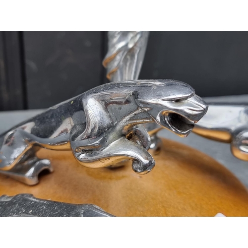 1520 - Automobilia: an unusual display of four vintage chrome car mascots, to include three Jaguar examples... 