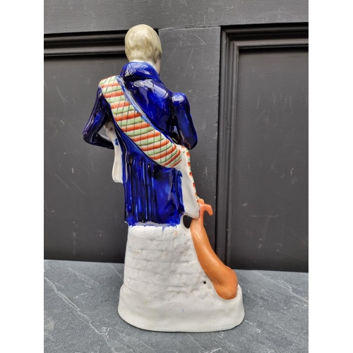 1536 - A large Victorian Staffordshire pottery figure of 'Walter Scott', 36.5cm high.