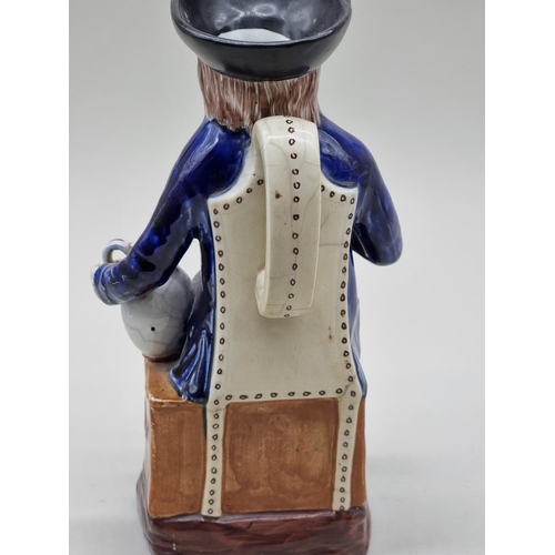 1557 - A 19th century Pearlware 'Rodney's Sailor' toby jug, possibly Ralph Wood, 29cm high.... 