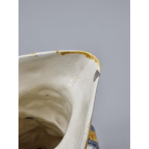 1558 - A late 18th century Creamware toby jug, 25cm high, (s.d.).