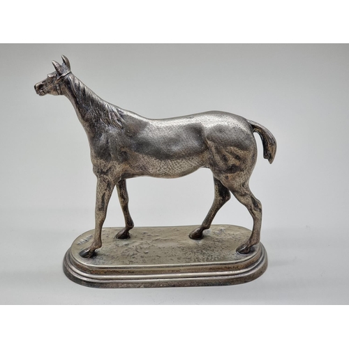 1560 - An electroplated race horse, 24.5cm high.