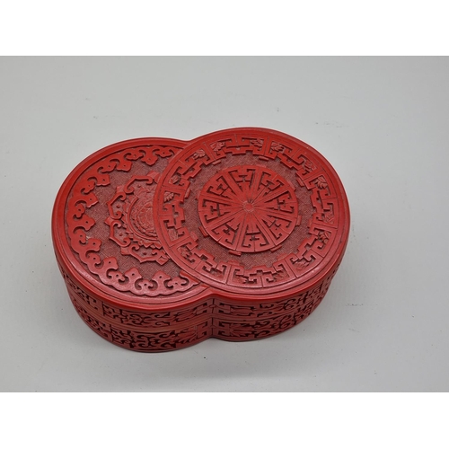 1572 - A Chinese cinnabar lacquer box and cover, 17cm wide.