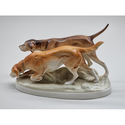 1575 - A Royal Dux figure group of two gun dogs, 30cm wide.