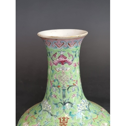 1578 - A Chinese lime-green ground famille rose vase, 17.5cm high.   