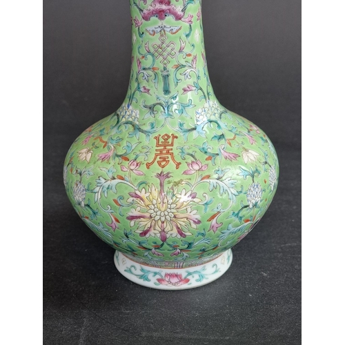 1578 - A Chinese lime-green ground famille rose vase, 17.5cm high.   