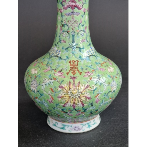 1578 - A Chinese lime-green ground famille rose vase, 17.5cm high.   