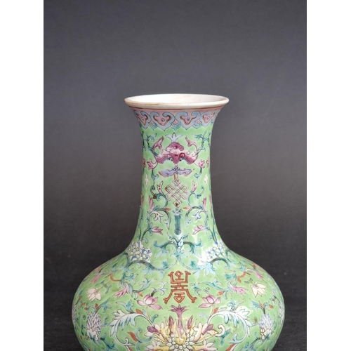 1578 - A Chinese lime-green ground famille rose vase, 17.5cm high.   