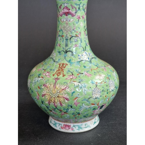 1578 - A Chinese lime-green ground famille rose vase, 17.5cm high.   