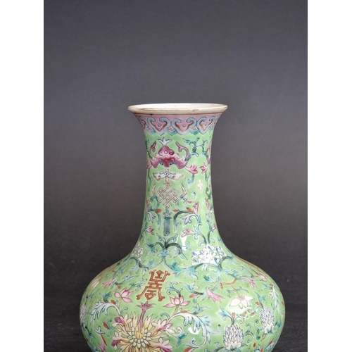 1578 - A Chinese lime-green ground famille rose vase, 17.5cm high.   