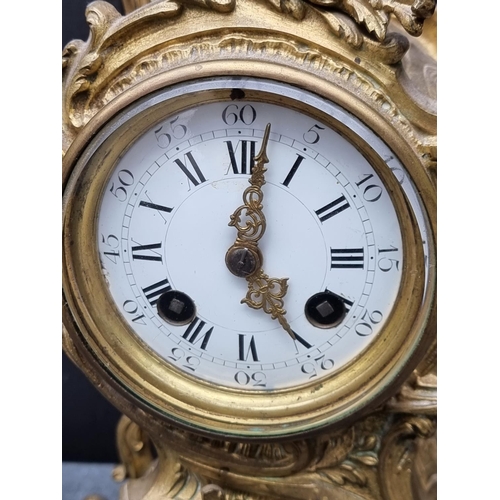 1579 - A Louis XV style gilt brass rococo mantel clock, 29.5cm high. 