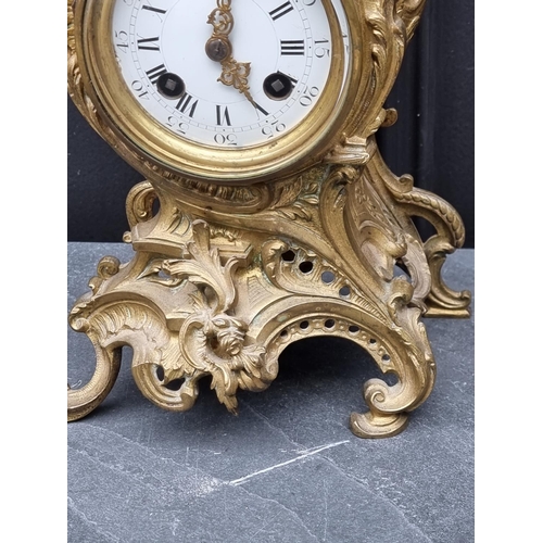 1579 - A Louis XV style gilt brass rococo mantel clock, 29.5cm high. 