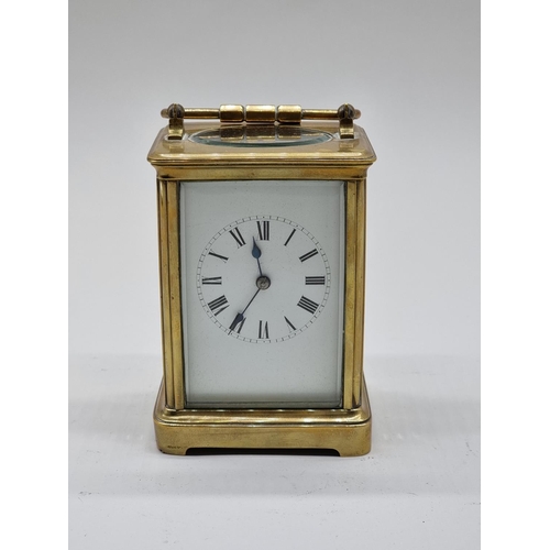 1591 - An old brass carriage timepiece, height including handle 17.5cm.